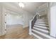 Grand foyer features hardwood floors, staircase with iron railings, and an office space at 1364 Manget Way, Dunwoody, GA 30338