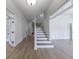 Spacious foyer featuring hardwood floors, staircase, and white trim at 1364 Manget Way, Dunwoody, GA 30338