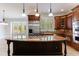 Beautiful kitchen with a large island, custom cabinets and stainless steel appliances at 1364 Manget Way, Dunwoody, GA 30338