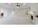 Bright living room features tray ceilings, a fireplace, and ample natural light at 1364 Manget Way, Dunwoody, GA 30338