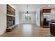 Cozy living room featuring a stone fireplace and ample natural light at 1364 Manget Way, Dunwoody, GA 30338