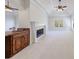 Inviting living room featuring a fireplace, wet bar area, and windows at 1364 Manget Way, Dunwoody, GA 30338