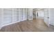 Bright room with built-in bookcases, hardwood floors, and French doors at 1364 Manget Way, Dunwoody, GA 30338
