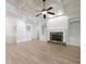 Bright living room boasts a stone fireplace, built-in shelves, and coffered ceilings at 1364 Manget Way, Dunwoody, GA 30338