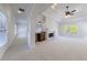 Spacious living room with a fireplace, tray ceilings, and a wet bar area at 1364 Manget Way, Dunwoody, GA 30338