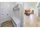 Functional mudroom with built-in shelving, bench, and hooks for organization at 1364 Manget Way, Dunwoody, GA 30338