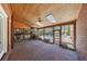 Serene covered patio with brick floors, stone fireplace, and access to the pool area at 1364 Manget Way, Dunwoody, GA 30338