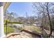 Charming view from the balcony overlooks a green, sloped front lawn at 1364 Manget Way, Dunwoody, GA 30338