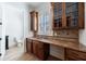 Butler's pantry with wet bar with sink, granite countertops and custom cabinets at 1364 Manget Way, Dunwoody, GA 30338