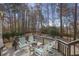 Relaxing back deck with green-striped seating and wooded view at 549 Trailwood Sw Ln, Marietta, GA 30064