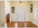 Inviting entryway with hardwood floors and bright white trim and front door at 549 Trailwood Sw Ln, Marietta, GA 30064