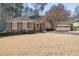Charming brick ranch-style home with lush landscaping and an attached two-car garage at 549 Trailwood Sw Ln, Marietta, GA 30064