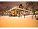 Charming building exterior illuminated by lights, set against a snowy backdrop, creating a cozy ambiance at 549 Trailwood Sw Ln, Marietta, GA 30064