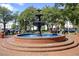 Beautiful tiered fountain with brick base, creating a tranquil focal point in a public park at 549 Trailwood Sw Ln, Marietta, GA 30064
