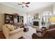 Bright living room featuring a fireplace, built-in shelving, and large windows at 549 Trailwood Sw Ln, Marietta, GA 30064