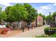 Charming outdoor seating area at local cafe with brick building in a peaceful environment at 549 Trailwood Sw Ln, Marietta, GA 30064