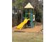 Playground featuring a yellow slide, climbing structure, and swingset at 549 Trailwood Sw Ln, Marietta, GA 30064