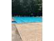 Community pool with marked lanes and a spacious deck area at 549 Trailwood Sw Ln, Marietta, GA 30064