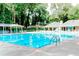 Large community pool with clear blue water, lounge chairs and covered seating areas at 549 Trailwood Sw Ln, Marietta, GA 30064