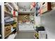 Organized storage room with built-in shelving and white cabinets for ample storage at 549 Trailwood Sw Ln, Marietta, GA 30064