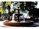 Scenic view of town square with a classic water fountain and gazebo set against a backdrop of trees at 549 Trailwood Sw Ln, Marietta, GA 30064