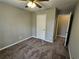 Bedroom with neutral walls and carpeting, ceiling fan, and access to hallway and closet at 2179 Summertown Dr, Norcross, GA 30071