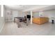 Open basement featuring a ping pong table, large sectional sofa, and tiled flooring at 1875 Ebenezer Sw Rd, Conyers, GA 30094
