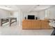 Finished basement featuring a sectional sofa, TV, and game tables perfect for entertainment at 1875 Ebenezer Sw Rd, Conyers, GA 30094
