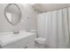Bathroom featuring white vanity and white shower curtain at 1875 Ebenezer Sw Rd, Conyers, GA 30094