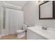 Bright bathroom featuring a combined tub and shower and a white vanity at 1875 Ebenezer Sw Rd, Conyers, GA 30094
