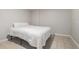Minimalist bedroom with a white bed and tile flooring at 1875 Ebenezer Sw Rd, Conyers, GA 30094