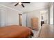 Spacious bedroom with a view into an ensuite bathroom and natural wood furniture at 1875 Ebenezer Sw Rd, Conyers, GA 30094