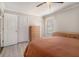 Bedroom featuring a wooden bed frame, natural walls, and a ceiling fan at 1875 Ebenezer Sw Rd, Conyers, GA 30094