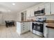 Kitchen with stainless steel appliances, wood countertops, and an adjacent dining area at 1875 Ebenezer Sw Rd, Conyers, GA 30094