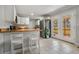 Bright kitchen featuring a breakfast bar, stainless steel appliances, and an exterior door to the deck at 1875 Ebenezer Sw Rd, Conyers, GA 30094