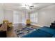 Bright living room with hardwood floors, plantation shutters, and comfortable seating, perfect for relaxation at 1875 Ebenezer Sw Rd, Conyers, GA 30094