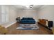 Inviting living room with hardwood floors, a plush sofa, and stylish decor, creating a cozy atmosphere at 1875 Ebenezer Sw Rd, Conyers, GA 30094