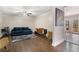 Comfortable living room featuring hardwood floors, modern decor, and access to the porch at 1875 Ebenezer Sw Rd, Conyers, GA 30094