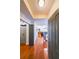 Inviting entryway featuring hardwood floors, gray doors, and a glimpse into the living spaces, offering a warm welcome at 230 E Ponce De Leon Ave # 327, Decatur, GA 30030