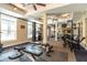 Well-equipped fitness center with various exercise machines and natural light at 230 E Ponce De Leon Ave # 327, Decatur, GA 30030