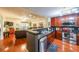 Stylish kitchen featuring stainless steel appliances, dark countertops, and hardwood floors, flowing into a living area at 230 E Ponce De Leon Ave # 327, Decatur, GA 30030