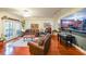 Open living space with hardwood floors, plush sofas, and access to a balcony, seamlessly connecting indoor and outdoor living at 230 E Ponce De Leon Ave # 327, Decatur, GA 30030