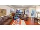 Inviting living room features hardwood floors, comfortable leather furniture, and an open layout to the kitchen at 230 E Ponce De Leon Ave # 327, Decatur, GA 30030