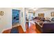 Inviting living room with hardwood floors, leather furniture, and view into the bedroom at 230 E Ponce De Leon Ave # 327, Decatur, GA 30030