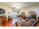 Comfortable living room with hardwood floors, ceiling fan, leather furniture, and access to outdoor space at 230 E Ponce De Leon Ave # 327, Decatur, GA 30030