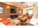 Cozy lounge area with comfortable seating, a large TV, and stylish decor at 230 E Ponce De Leon Ave # 327, Decatur, GA 30030