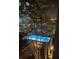 Elevated view of a community pool illuminated at night visible through a tree at 230 E Ponce De Leon Ave # 327, Decatur, GA 30030