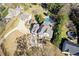 Aerial view of the property displaying the home, long driveway, and swimming pool at 695 Old Peachtree Rd, Lawrenceville, GA 30043