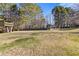 Wide-open backyard with a tree house and a chicken coop at 695 Old Peachtree Rd, Lawrenceville, GA 30043