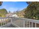 Backyard view from the deck featuring a lawn and play equipment at 695 Old Peachtree Rd, Lawrenceville, GA 30043